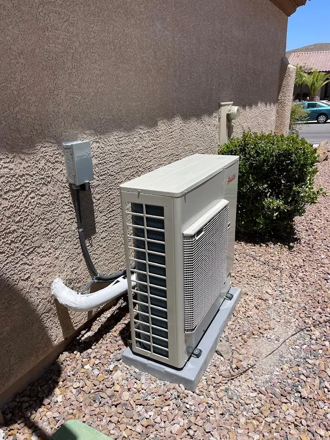 Residential air conditioning condenser unit in St. Peter